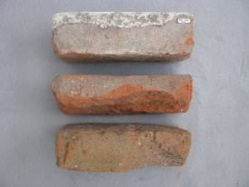 3 red/orange bricks; one with motar