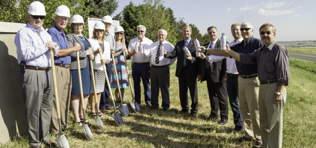 Partners in the Northwest Douglas County Water Project celebrate the project groundbreaking. (L to R) John Kaufman, General Manager Centennial Water and Sanitation District; Dave Thomas, Board President Roxborough Water and Sanitation District; Barbara Biggs, Metro Roundtable Chair Colorado Water Conservation Board; Jill Repella, Douglas County Commissioner; Jack McCormick, Homeowner Plum Valley Heights; Lisa Darling, Water Resources Manager Aurora Water; Gary Schroeder, Chatfield Acres Subdivision; Keith Lehman, Chatfield East Subdivision; Roger Partridge, Douglas County Commissioner; Dave Weaver, Douglas County Commissioner; Tim Murrell, Water Resources Planner Douglas County; Larry Moore, General Manager Roxborough Water and Sanitation District and Bernie Baron, Titan Road Industrial Park.