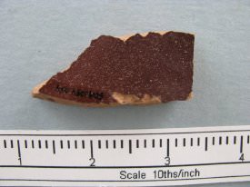 Rust/brown glazed crodkery shard ; dorsal view