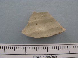 Crockery shard; green/brown; curved