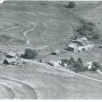 Black and white aerial view of the Lorraine Ranch in 1964 in Douglas County with house, barns, and other structures
