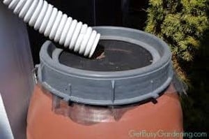 rain barrel downspout into mosquito screen